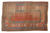 Antique Caucasian madder root red carpet with indigo blue borders and pawn motif.