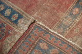 Visible pile wear on an Antique Caucasian rug border with pawn motif, showing exposed foundation threads.