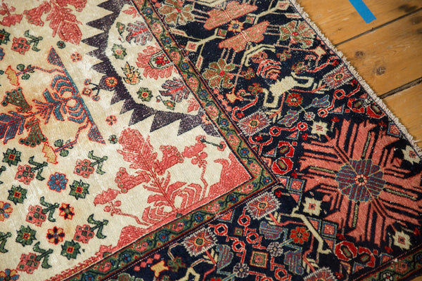 Corner of antique Farahan Sarouk rug showing the serrated medallion and dynamic navy border, size 4'3