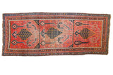 Antique Karabagh runner with germinating tree, bird, animal motifs in fuchsia, navy, and blush.