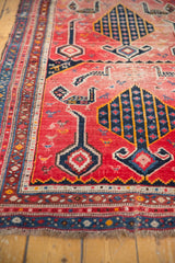 Armenian Karabagh runner detail: intricate navy, red border, faded fuchsia field, and bird motifs.