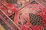 Antique Karabagh runner detail: navy tree motif, fuchsia field, with ivory and blue birds.