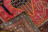 Antique Karabagh runner's folded corner with fuchsia field, hand-knotted reverse, and textured fringe.