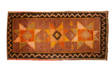 Hand knotted Vintage Oushak runner with triple starbursts, earth tones, and zig-zag border.