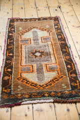 Tangerine pearl and vine border detail on a vintage Turkish Oushak rug's corner.