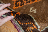 Thick, hand-knotted pile and tightly secured side of the vintage Oushak rug.