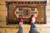 Vintage Oushak rug mat with thick pile, geometric medallion in camel and tangerine orange.