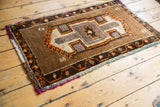 Vintage Oushak rug corner, chocolate brown pearl and vine border, tangerine motifs, thick pile.