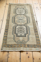 Distressed Oushak rug, triple medallions featuring rams horn and tree of life motifs.
