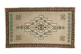 Decorative distressed Oushak rug mat, geometric medallions in antique ivory, mint green, bronze brown, 1'8