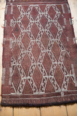Intricate ivory geometric pattern and dark border on a vintage Turkish Jijim rug.