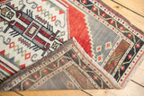 Vintage Oushak rug corner showing fringe, original selvages, and woven reverse.