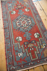 Brick red vintage Oushak rug's slate blue border, zigzag pattern, and fine woven florals.