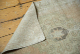 Distressed vintage Oushak runner texture, showing wear and hand-knotted reverse.