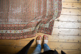 Distressed vintage Mir Serbend rug, worn madder root red field, distinct Mir boteh pattern, multi-colored borders.