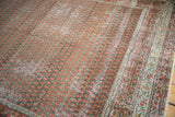 Detail of distressed Persian Mir Serbend carpet, showcasing madder red boteh and softened slate blue.