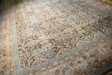 Decorative distressed Sivas carpet detail, featuring brown floral palmettes and a pale rose border.