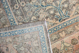 Distressed Sivas carpet corner showing textural pile, faint foundation, and intact selvage.