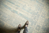 Textural detail of powder blue and antique ivory patterns on a vintage Khotan carpet.