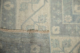 Visible hand-knotted foundation and powder blue Samarkand style motifs on a vintage Pakistani Khotan carpet.