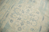 Vintage Pakistani Khotan carpet detail with powder blue medallion and ivory field floral motifs.