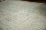 Vintage Pakistani Khotan rug, showcasing pale blue medallions and an intricate border design.