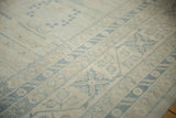 Pale blue Samarkand style motifs on an antique ivory Khotan rug field.