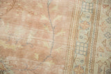 Distressed dusty rose field with exposed foundation and part of the sky blue border.