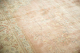 Distressed Turkish Sparta rug detail with traditional motifs, dusty rose field, and even wear.