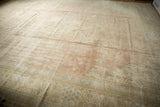 Distressed hand-knotted Turkish Sparta rug with mostly even wear, muted rose and ivory tones.