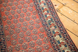 Even pile, repeating boteh pattern, and border detail of a vintage Persian runner.