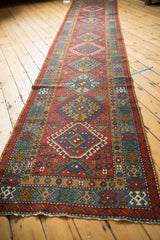Vintage Karaja rug runner viewed down its full length, highlighting the repeating geometric design.
