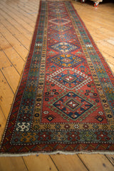 Full length view of a vintage Karaja runner's column of repeating diamond medallions.