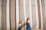 Textured vintage Moroccan Kilim runner with alternating bands of natural brown, ivory, and pale grey.
