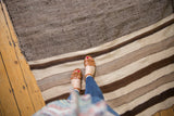 Vintage Moroccan Kilim runner showing undyed ivory and varied brown striped bands.
