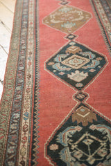 Madder root red field and navy blue herati medallions on a vintage Karabagh runner with even wear.
