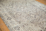 Angled view highlighting the mostly even wear on the vintage Hamadan's Herati pattern.