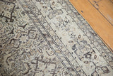Angled view of the vintage Hamadan runner's mostly even wear and neutral Herati pattern.