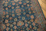 Intricate floral pattern on vintage Lilihan runner: navy blue field, terracotta, ivory, and blush tones.
