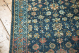 Vintage Lilihan rug detail: intricate floral field, geometric border, navy, powder blue, terracotta.