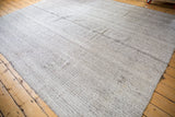 Variegated hand woven texture of the ivory and charcoal Turkish Kilim rug.