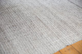 Ivory and charcoal hand woven texture of the up-cycled Turkish Kilim carpet.