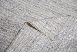 Hand woven Turkish Kilim texture detail, showing ivory and charcoal black threads.