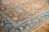 Distressed Mahal carpet corner; terracotta rust field, dusty teal border, and floral designs.
