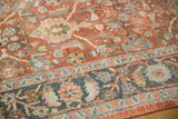 Distressed vintage Mahal with time-softened terracotta field and dusty teal splayed floral border.