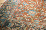 Distressed Mahal rug corner highlights terracotta rust, dusty teal splayed floral motifs.