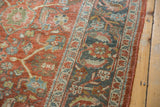 Distressed Mahal rug border with faded terracotta, dusty teal, and ivory floral patterns.