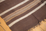 Vintage Moroccan Kilim's hand-woven textured brown and ivory striped bands with short fringe.