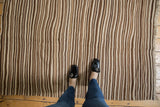 Moroccan Kilim rug's hand-woven striated pattern in natural beige and brown.