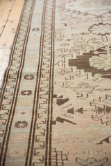 Distressed Serab runner: brown geometric border, low pile beige, sand, and pale blue motifs.
